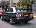 Un taxi dans les rues de Santiago du Chili.<br>Les sacs en plastique sont fournis aux passagers ?
