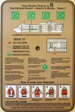 [no_rights] <i>Grand Princess</i>.<br>Instructions de sécurité, affichées sur la face intérieure de la porte de la cabine C308.<br>Notre point de ralliement (<i>Muster Station</i>) est B, sur le pont 7, au niveau du bar <i>Painted Desert</i>.<br><br>Comme le veut la règlementation internationale, tous les passagers effectuent un exercice d'évacuation, dans les 24 heures qui suivent leur embarquement.